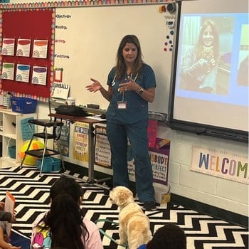 Christen and dog Barkley at school (1) Christen teaching kids about being a vet tech.